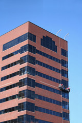 window cleaners on skyscraper