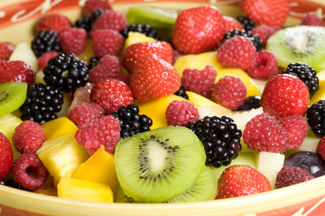 Delicious fruit salad with kiwi, strawberries and blackberries