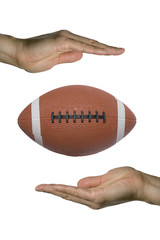 two hands holding a football (vertical)