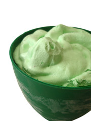 green kiwi ice-cream in basket on white background
