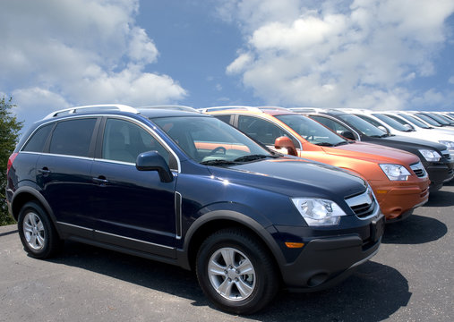 New Fuel Efficient SUV's On A Car Dealers Lot For Sale.