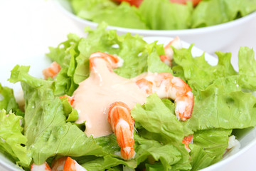 white bowl with prawns salad and mayonnaise sauce