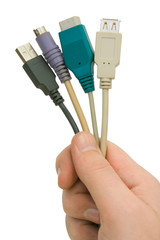 Computer cables in hand, isolated on white background