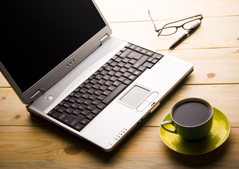 laptop and a cup of coffee