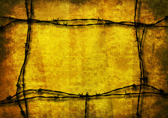 Yellow grunge background framed with barbed wire