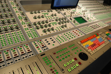 panel of buttons on audio mixing console