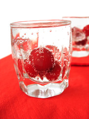 Cherry in glass of mineral water