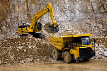 Quarry Dumper being loaded by Excavator