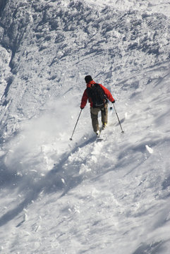 Skier on Mont Blanc mountain range viewed from Aiguille Du Midi