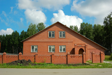Residential house with beautiful landscaping in front yard