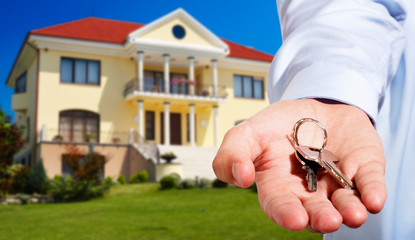 House owner/real estate agent giving away the keys