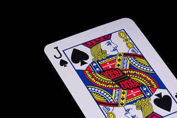 A poker card slanted view over black background