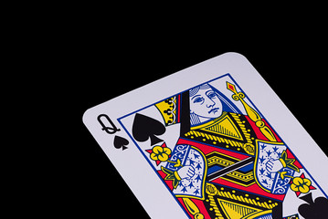 A poker card slanted view over black background