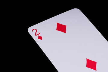 A poker card slanted view over black background