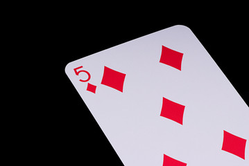 A poker card slanted view over black background