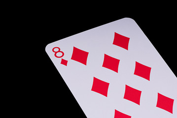 A poker card slanted view over black background
