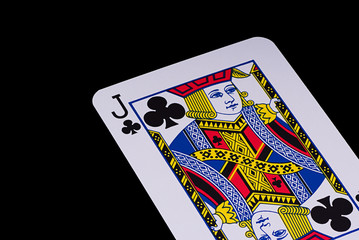 A poker card slanted view over black background