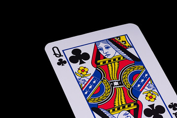 A poker card slanted view over black background