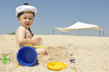 a boy playing on the beach