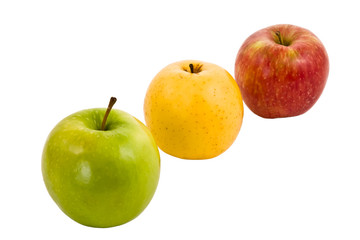 Three fresh apples of different colors on a white background