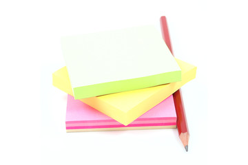 post-it notes and pencil isolated on white