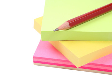 post-it notes and pencil isolated on white