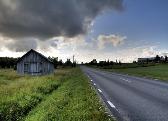 Roadside barn in a swedish rural scenery