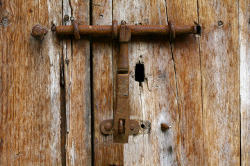 Old iron rust lock on old wooden door