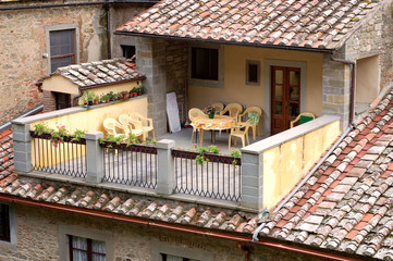 A pretty patio with chairs and table in Tuscany, Italy.