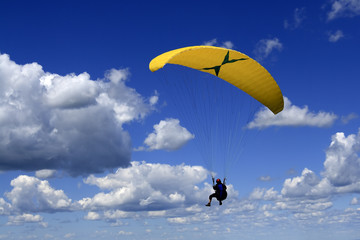 paragliding in a deep blue sky