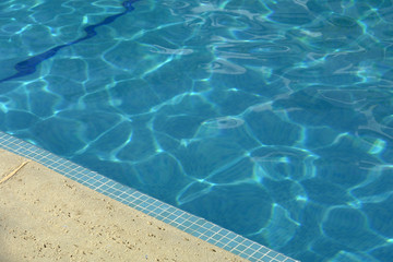 Fototapeta na wymiar swimming pool blue water in a summer day
