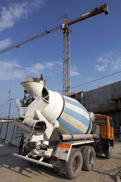 Concrete mixer driving in a building site.