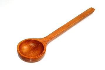 Wooden spoon against a white background