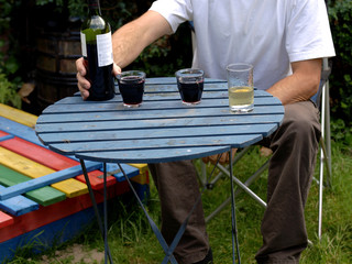 Man sitting and relaxing, drinking wine