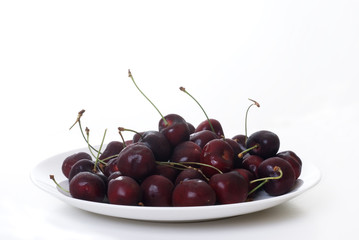 black cherry on a white plate