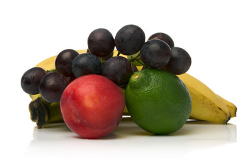 red plum lime grapes and banana