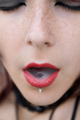 Lady with red lips smoking