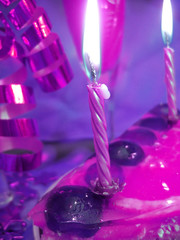 cake and candles on violet color