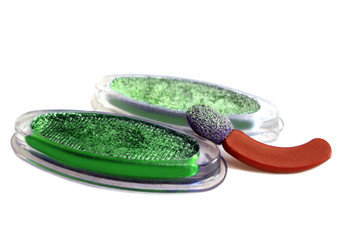 green eyeshadows and applicator brush isolated