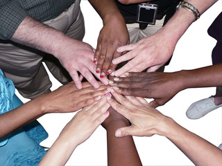 stacked hands of a diverse team to showcase teamwork