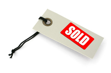 Tag with SOLD inscription against white, 