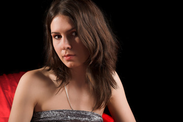 young beaty girl in grey fabric on black background