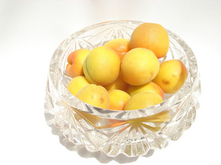 crystal dish with ripe apricots