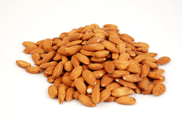 A group of shelled almond nuts on a white background.