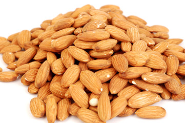 A group of shelled almond nuts on a white background.