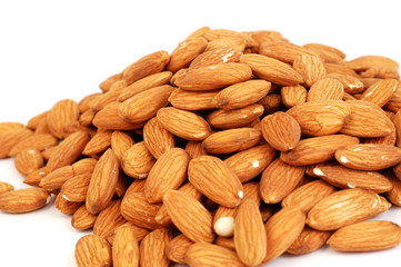 A group of shelled almond nuts on a white background.