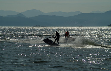 men on water motorcycles