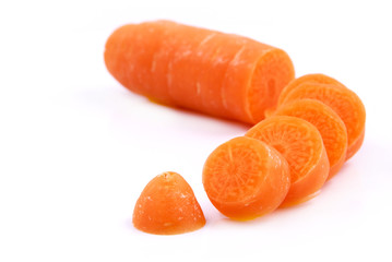 Chopped up Carrot in small slices on white background