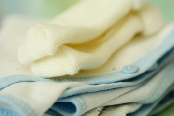 A macro shot of baby clothing and socks