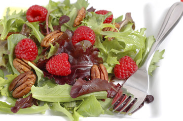 Fresh summer salad with raspberries and pecans.